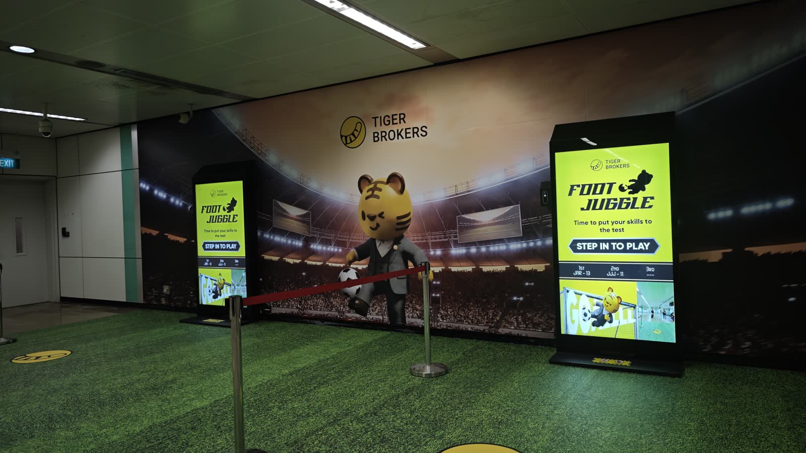 Tiger Brokers Foot Juggle — stadium-wrapped concourse at Bugis MRT